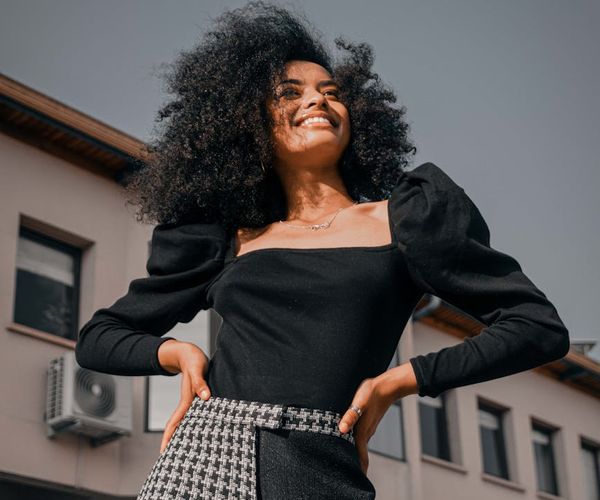 Woman feeling energetic and happy outdoors.